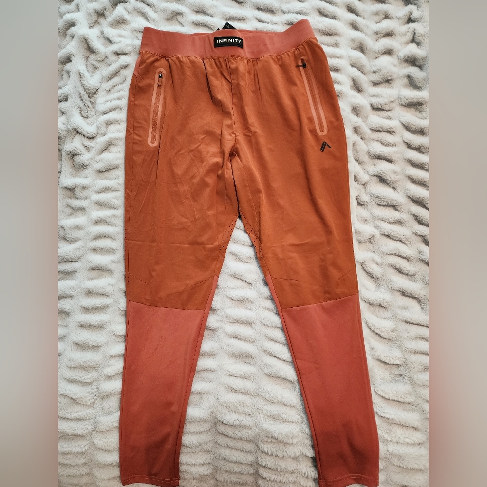 Alphalete Infinity Tech Pants (Soir Tangerine)